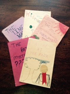 Handmade children’s book titled 'A Day at the Park,' featuring illustrations and a yellow cover, representing a young writer’s first published story